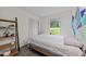 Cozy bedroom featuring a closet, a side shelf, and a window that allows natural light to fill the space at 6125 Bellow St, Raleigh, NC 27609