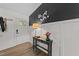 Stylish foyer with a decorative table, lamp, and unique wall decor at 6125 Bellow St, Raleigh, NC 27609