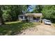 Charming home with a well-manicured lawn, a covered porch, and a paved driveway at 6125 Bellow St, Raleigh, NC 27609