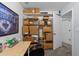 Practical office space with shelving, storage, and natural light from the nearby window at 6125 Bellow St, Raleigh, NC 27609