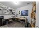 Functional office space with ample desk area and shelving for storage and projects at 6125 Bellow St, Raleigh, NC 27609
