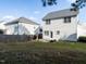 Back exterior with white siding and a fenced yard with a fire pit at 637 Prickly Pear Dr, Fuquay Varina, NC 27526