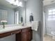 Well-lit bathroom with vanity, neutral walls and tiled floor at 637 Prickly Pear Dr, Fuquay Varina, NC 27526