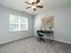 Bedroom with large window, desk and a world map art piece at 637 Prickly Pear Dr, Fuquay Varina, NC 27526