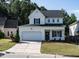 Charming two-story home features a two-car garage, welcoming front porch, and beautifully landscaped front yard at 637 Prickly Pear Dr, Fuquay Varina, NC 27526
