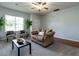 Inviting living room featuring neutral walls, comfortable seating, and natural light at 637 Prickly Pear Dr, Fuquay Varina, NC 27526