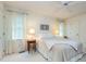 Bright bedroom with natural light, neutral décor, ceiling fan and carpeted floors at 6922 Saxby Ct, Raleigh, NC 27613