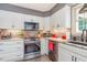 Bright kitchen featuring stainless appliances, undermount sink, and granite countertops at 6922 Saxby Ct, Raleigh, NC 27613