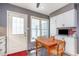 Eat-in kitchen features a bright breakfast nook with table and a backyard view at 6922 Saxby Ct, Raleigh, NC 27613