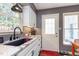Bright kitchen featuring stainless appliances, undermount sink, and granite countertops at 6922 Saxby Ct, Raleigh, NC 27613