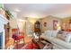 Warm and inviting living room with hardwood floors, a fireplace, and comfortable seating at 6922 Saxby Ct, Raleigh, NC 27613