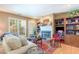 Cozy living room with a fireplace, hardwood floors, and a comfortable seating area at 6922 Saxby Ct, Raleigh, NC 27613