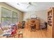 Bright office space featuring hardwood floors, a vintage roll-top desk, and a window for natural light at 6922 Saxby Ct, Raleigh, NC 27613