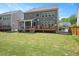 Back exterior view featuring a deck, screened porch and sprawling backyard at 745 Orange Oak Ln, Apex, NC 27523