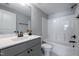 Bathroom features a vanity with sleek countertop, cabinet and a shower-tub combo at 745 Orange Oak Ln, Apex, NC 27523