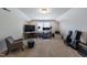 Spacious bonus room featuring work space, audio and video equipment and carpet flooring at 745 Orange Oak Ln, Apex, NC 27523