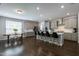Spacious kitchen with gray cabinets, stainless steel appliances, and a large island with bar seating at 745 Orange Oak Ln, Apex, NC 27523