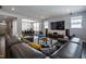 Comfortable living room with large sectional sofa, open to dining area, and stylish furniture at 745 Orange Oak Ln, Apex, NC 27523