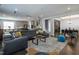 Spacious living area showcasing a large sectional, open floor plan, and stylish decor at 745 Orange Oak Ln, Apex, NC 27523