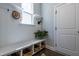 Bright mudroom with built-in bench and storage, natural light, and access to the exterior at 745 Orange Oak Ln, Apex, NC 27523