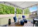 Relaxing screened-in porch with comfortable seating and views of the backyard at 745 Orange Oak Ln, Apex, NC 27523