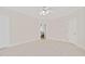 Airy bedroom boasts neutral carpet, trim, and light walls, creating a serene and inviting space at 7716 Micklewaithe Ct, Wake Forest, NC 27587