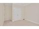 Clean bedroom offering neutral tones, a ceiling fan, and a spacious closet at 7716 Micklewaithe Ct, Wake Forest, NC 27587