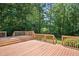 Large wooden deck with multiple levels and railings, perfect for outdoor entertaining at 7716 Micklewaithe Ct, Wake Forest, NC 27587
