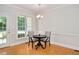 Cozy dining room with a table and chairs, adjacent to an exterior door at 7716 Micklewaithe Ct, Wake Forest, NC 27587