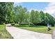 Inviting home with mature trees, lush lawn and long driveway at 7716 Micklewaithe Ct, Wake Forest, NC 27587