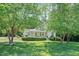 Charming home featuring a well-maintained lawn and inviting front porch at 7716 Micklewaithe Ct, Wake Forest, NC 27587