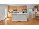 Bright kitchen boasts stainless appliances, light wood cabinetry, and a breakfast bar for casual dining at 7716 Micklewaithe Ct, Wake Forest, NC 27587