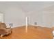 Expansive living room features hardwood floors, vaulted ceiling, and neutral paint at 7716 Micklewaithe Ct, Wake Forest, NC 27587