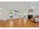 Living room with fireplace, built-in cabinets, and hardwood floors at 7716 Micklewaithe Ct, Wake Forest, NC 27587