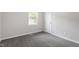Bright bedroom with carpet, a window for natural light, and a closet at 7824 Knightdale Blvd, Knightdale, NC 27545