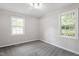 Neutral bedroom has carpet, natural light from the window, and plenty of space at 7824 Knightdale Blvd, Knightdale, NC 27545