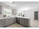 Bright, updated kitchen featuring gray cabinets, new appliances, and ample counter space at 7824 Knightdale Blvd, Knightdale, NC 27545