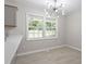 Bright kitchen featuring white countertops and contemporary lighting with backyard views at 7824 Knightdale Blvd, Knightdale, NC 27545