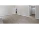 Spacious living room with wood-look floors, featuring multiple entryways and natural light at 7824 Knightdale Blvd, Knightdale, NC 27545