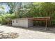 Exterior view of outbuilding/shed with carport attached at 7824 Knightdale Blvd, Knightdale, NC 27545