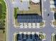 Aerial perspective of community layout, featuring townhomes, parking, pond and pool at 805 Grafton Peak Lane Ln, Apex, NC 27523