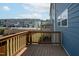 Relax on this wooden back deck overlooking a well-manicured community with beautiful townhome architecture at 805 Grafton Peak Lane Ln, Apex, NC 27523
