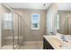 Modern bathroom featuring a tiled walk-in shower with glass doors and vanity at 805 Grafton Peak Lane Ln, Apex, NC 27523