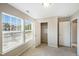 Well-lit bedroom featuring two windows, a closet and neutral carpeting at 805 Grafton Peak Lane Ln, Apex, NC 27523