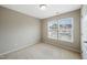 Comfortable bedroom with neutral walls, plush carpeting and well-lit space with a pair of windows at 805 Grafton Peak Lane Ln, Apex, NC 27523