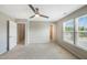 Bright, neutral bedroom featuring carpet, ceiling fan, natural light and ensuite bathroom at 805 Grafton Peak Lane Ln, Apex, NC 27523