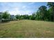 Spend time outdoors in the spacious, well-maintained community green space with surrounding trees at 805 Grafton Peak Lane Ln, Apex, NC 27523