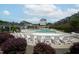 Enjoy the day at the community pool, which has plenty of chairs for lounging in the sun at 805 Grafton Peak Lane Ln, Apex, NC 27523
