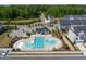 Aerial view of community pool and amenities with ample seating for residents' enjoyment at 805 Grafton Peak Lane Ln, Apex, NC 27523