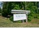 Entrance sign for the Townes at North Salem, surrounded by a green lawn and trees at 805 Grafton Peak Lane Ln, Apex, NC 27523